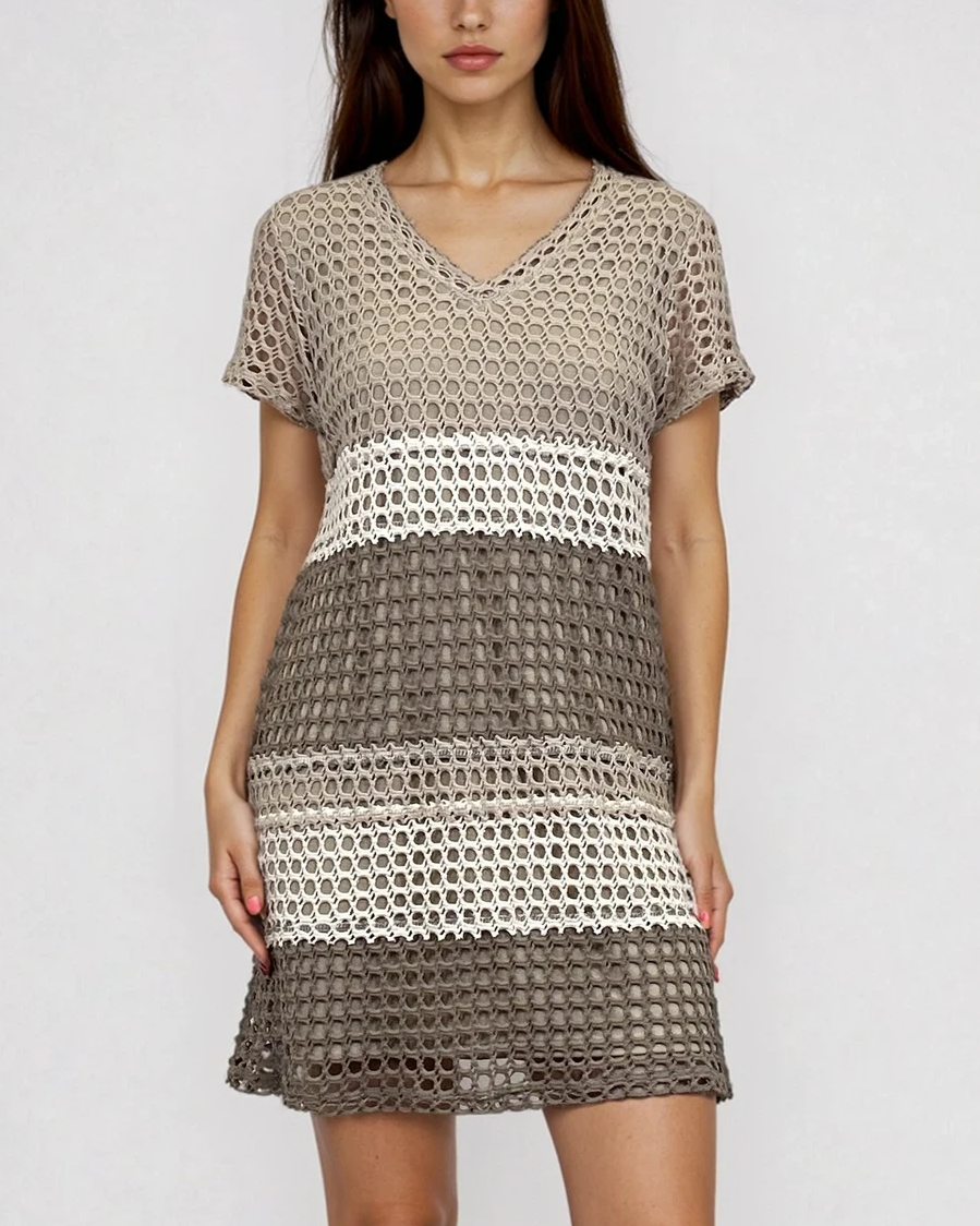 Female model wearing a crochet cotton knit dress in a stripe color block pattern in the colors linen, beige, oatmeal, ivory, bark, mocha, brown, neutrals. - Pete Collection