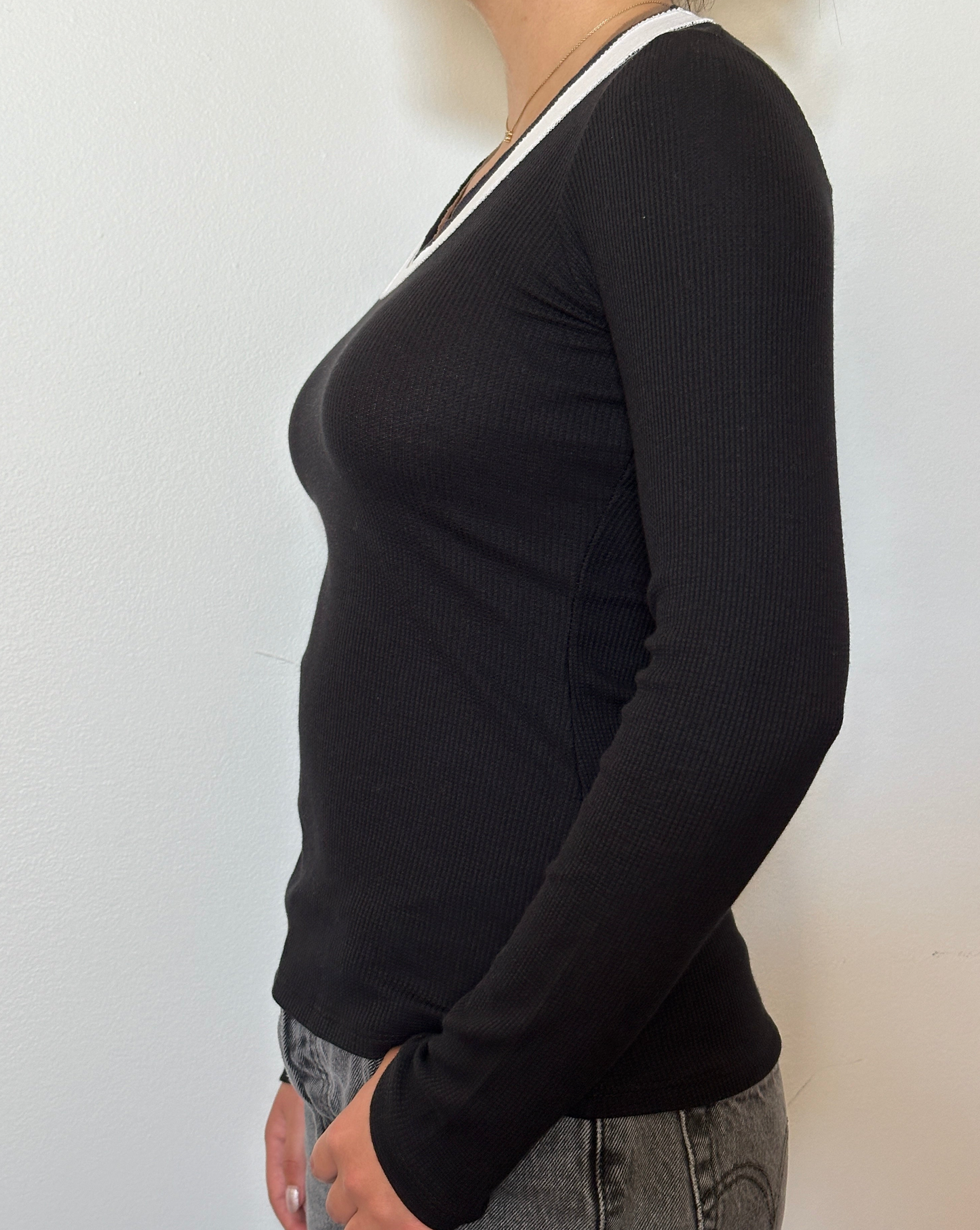 Female model wearing a black, white, and bark (beige) long sleeve cotton thermal knit - Pete Collection