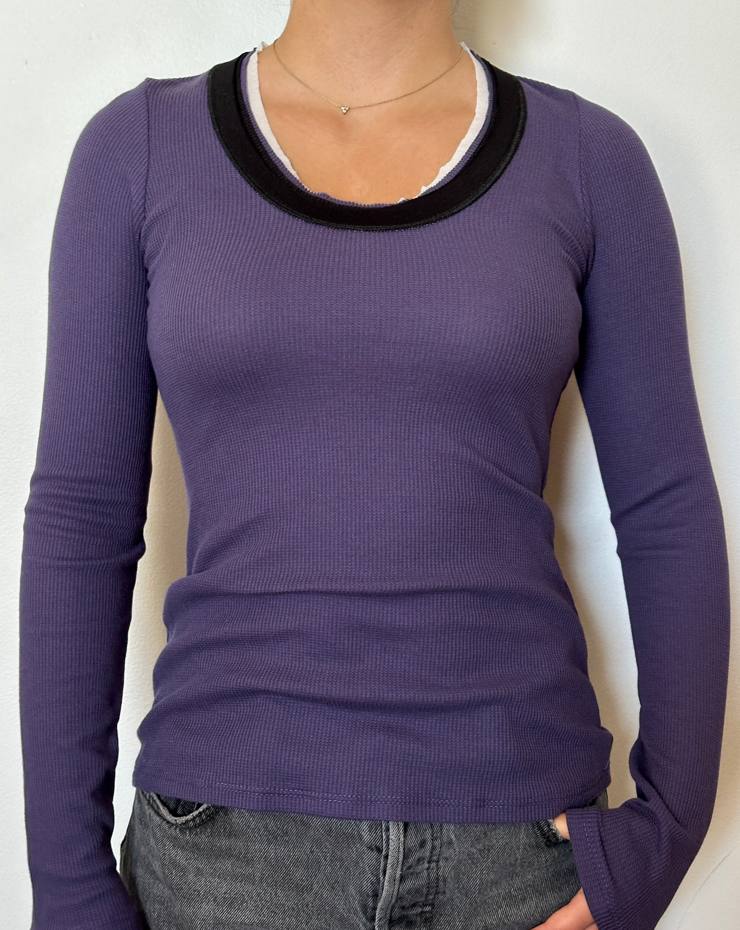 Female model wearing a violet, white, and black long sleeve cotton thermal knit - Pete Collection
