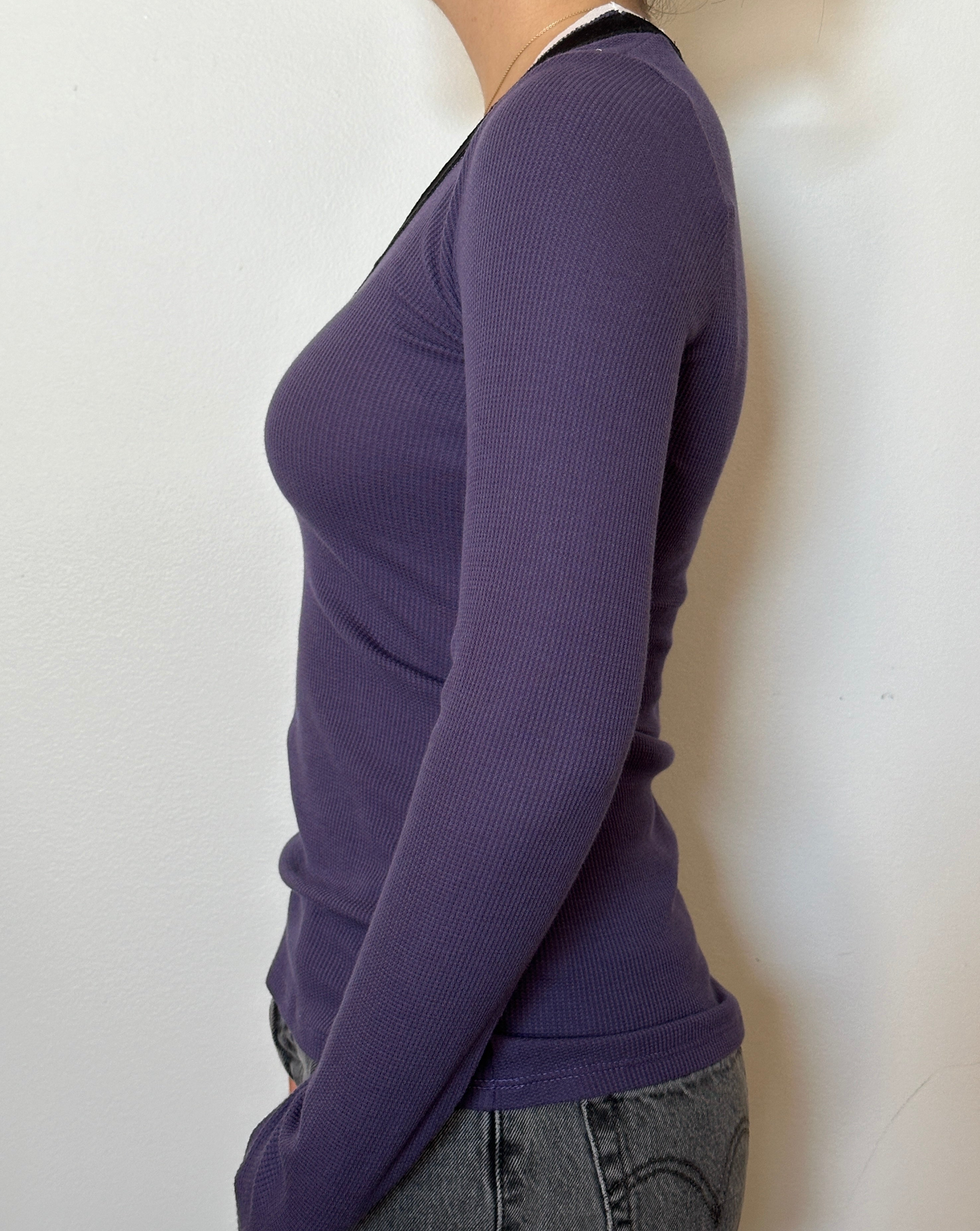 Female model wearing a violet, white, and black long sleeve cotton thermal knit - Pete Collection