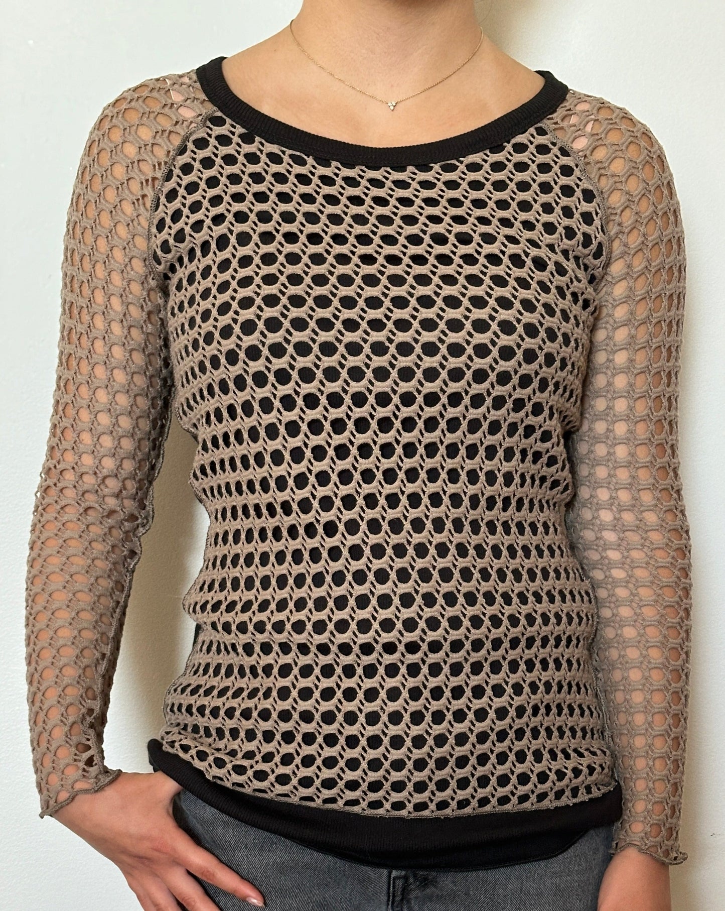 Female model wearing a crochet bark (beige) and black long sleeve cotton knit - Pete Collection