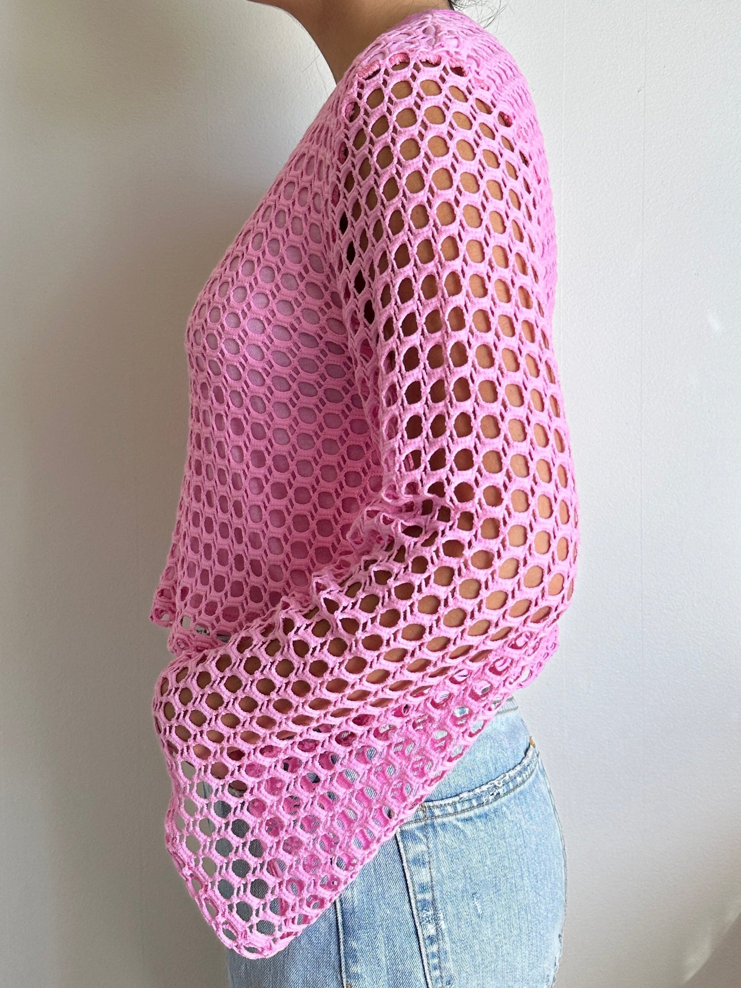 Female model wearing a pink crochet bell sleeve long sleeve cotton knit - Pete Collection