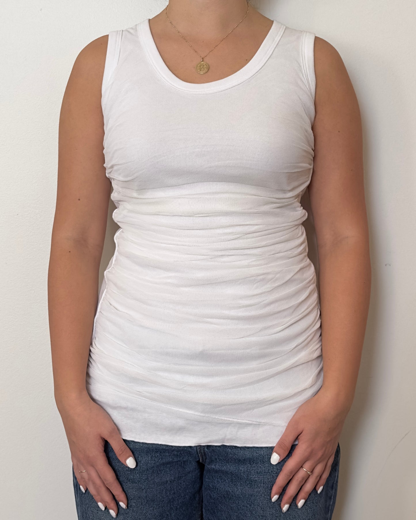 Female model wearing a cotton and mesh white tank top - Pete Collection