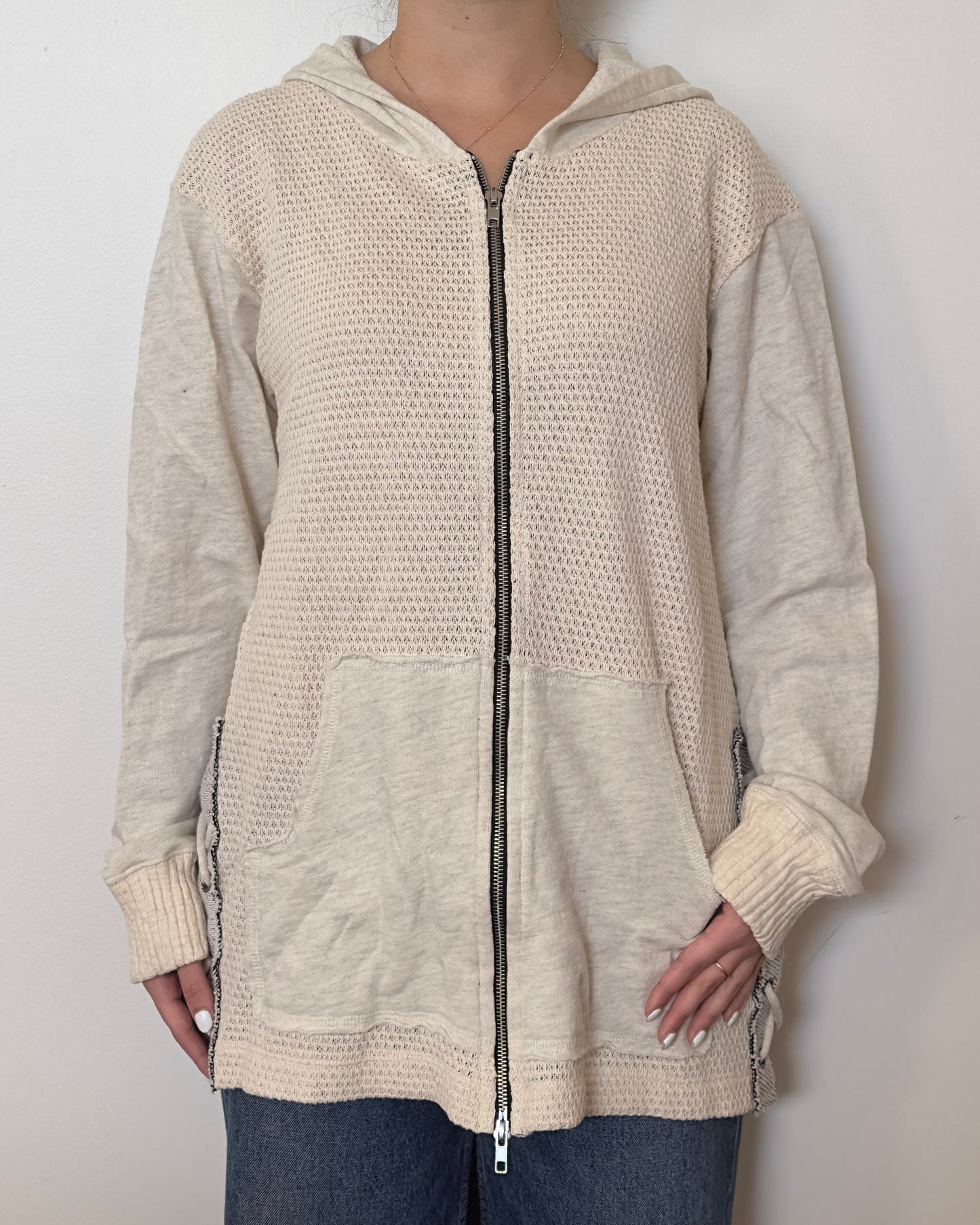 Female model wearing an oversized textured cotton jacket with patchwork sleeves and pockets and tied sides- Pete Collection