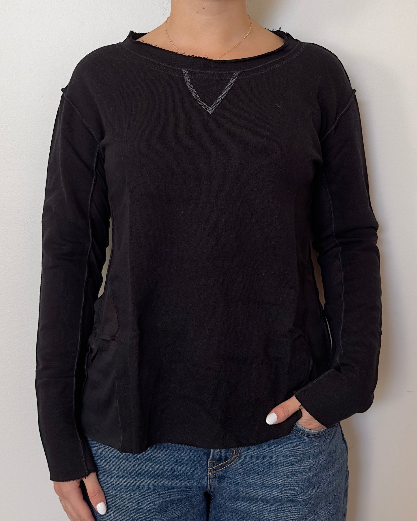 Female model wearing a cotton and mesh black long sleeve top with a mesh back - Pete Collection