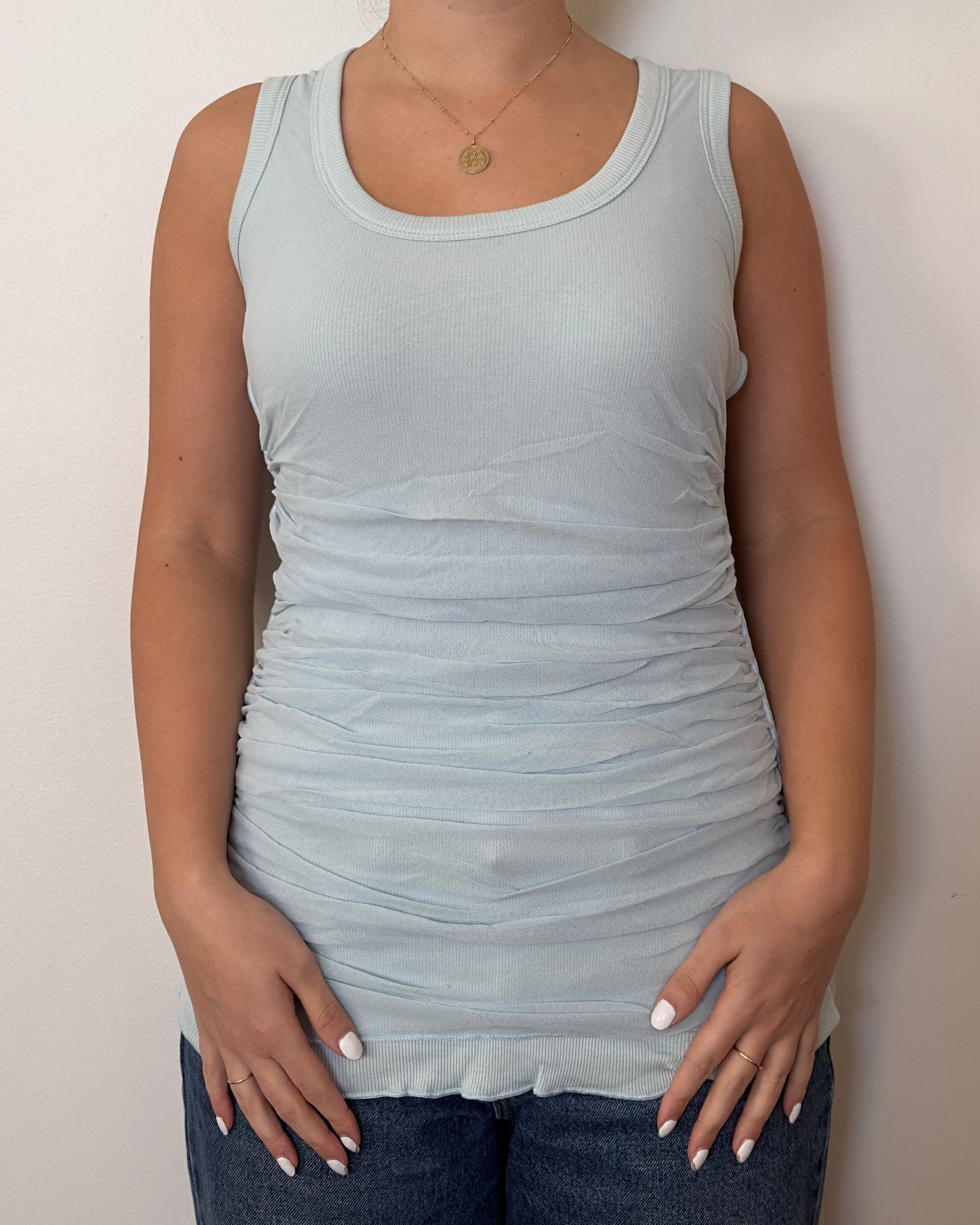 Female model wearing a cotton and mesh baby blue tank top - Pete Collection