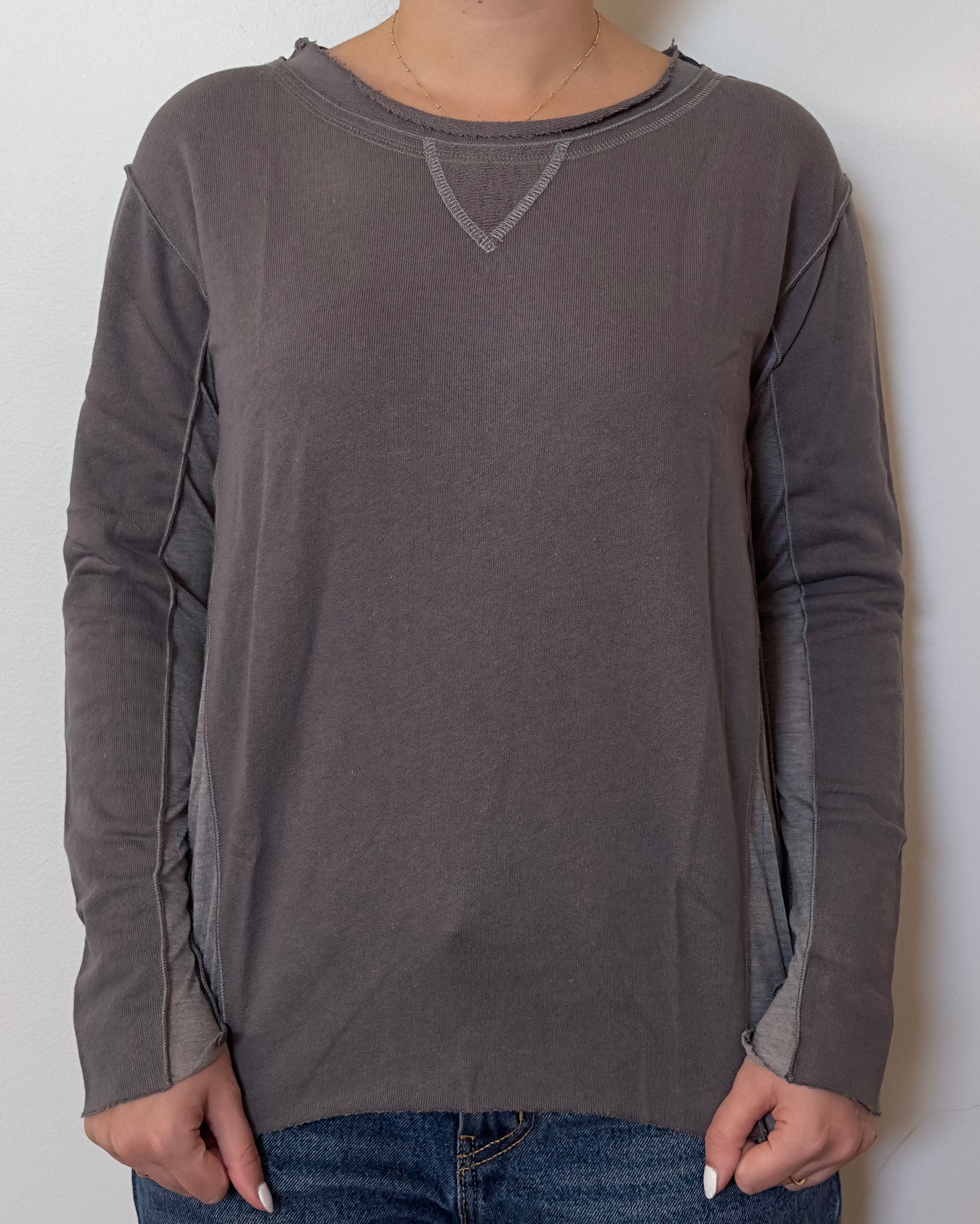 Female model wearing a cotton and mesh grey long sleeve top with a mesh back - Pete Collection
