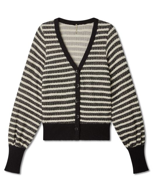 flat lay image of a striped black and white (ivory) sweater with jeans on a white background