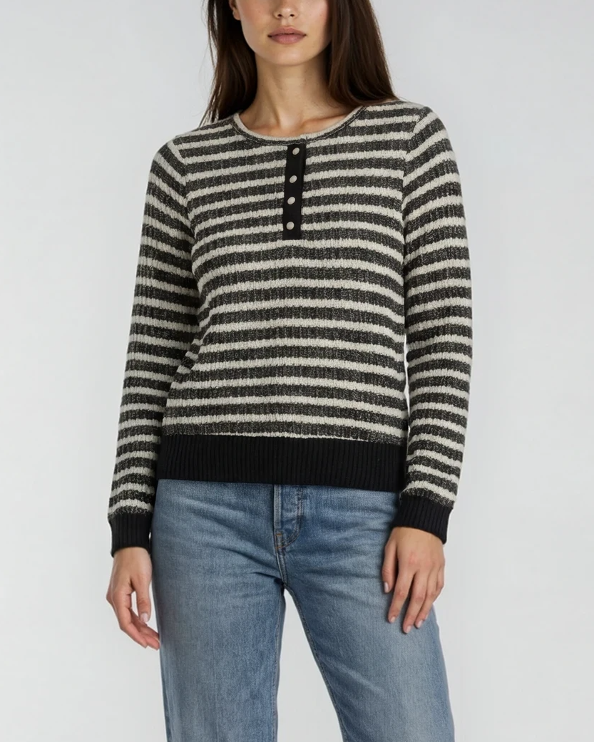 Female model wearing a striped long-sleeve Henley top with buttons and jeans on a white background