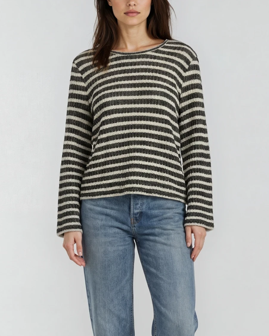 Woman model wearing a striped black and white (ivory) bell sleeve top with jeans on a white background. - Pete Collection