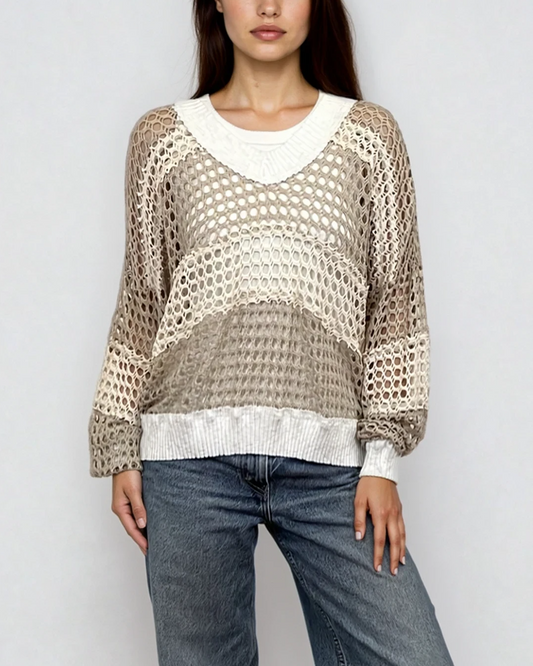 Female model wearing a v neck coconut milk (white) beige, and cream cotton crochet long sleeve top - Pete Collection
