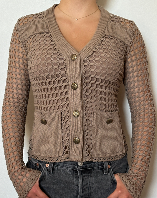 Female model wearing a bark (beige) long sleeve cotton crochet cardigan with pockets and a tank top - Pete Collection