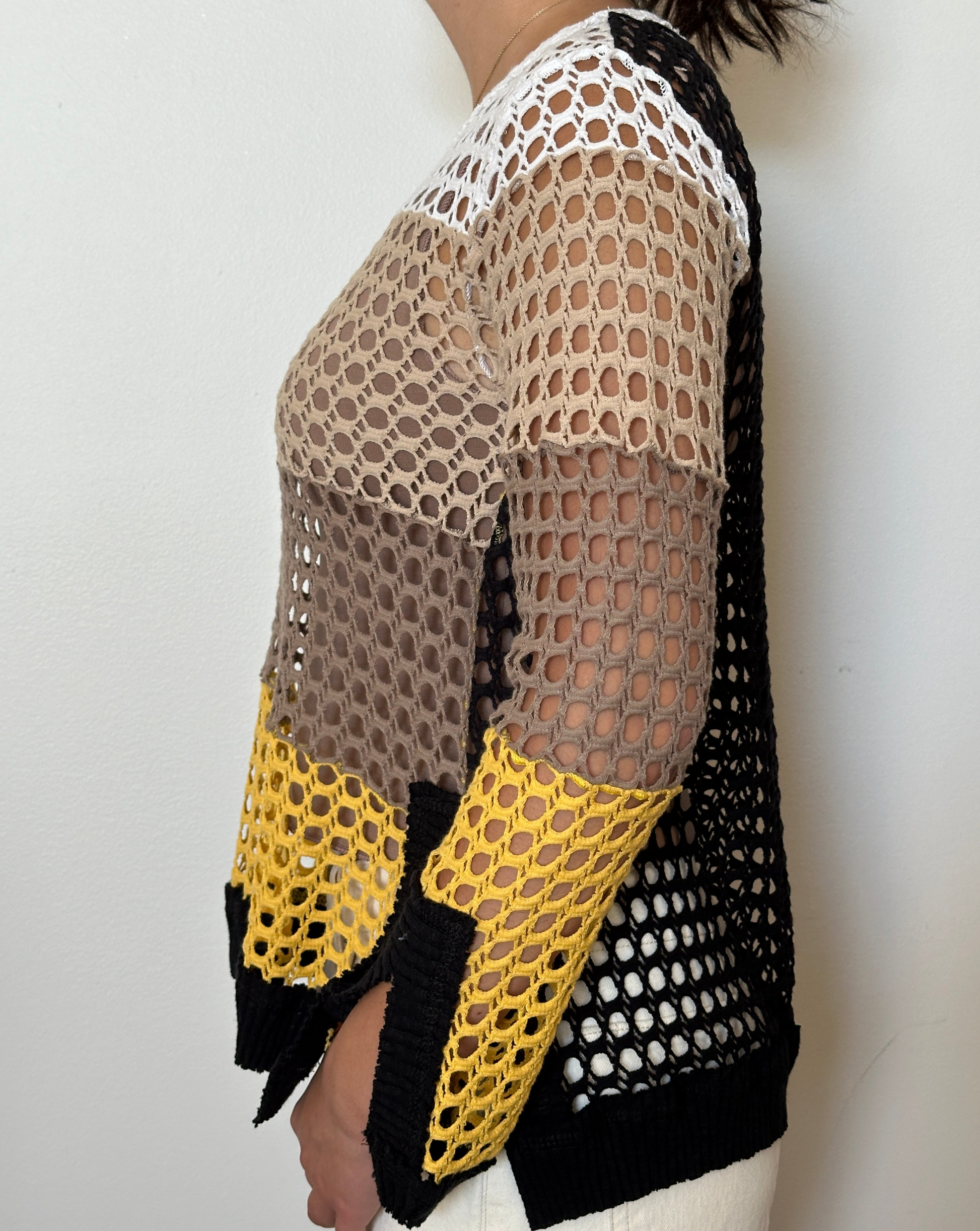 Female model wearing a crochet yellow,, beige, cream, and white long sleeve cotton knit - Pete Collection