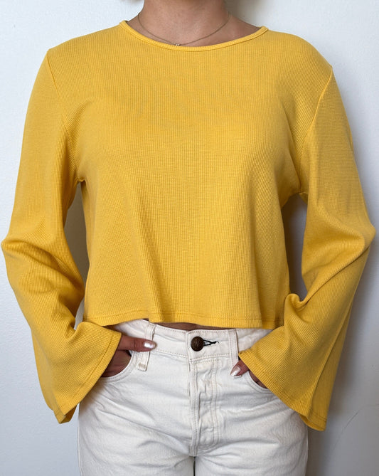 Female model wearing a tuscan sun (yellow) bell sleeve long sleeve cotton knit - Pete Collection