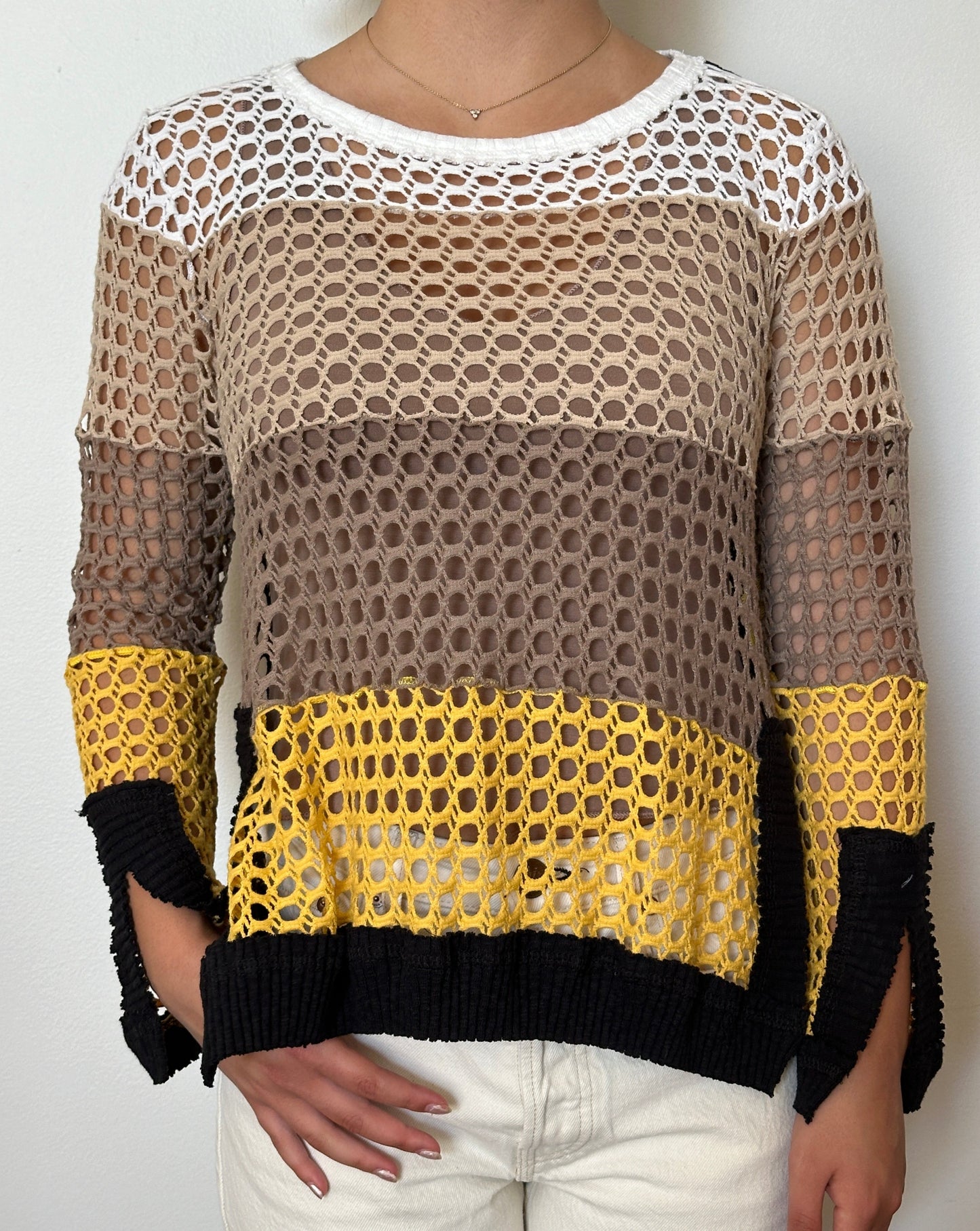 Female model wearing a crochet yellow,, beige, cream, and white long sleeve cotton knit - Pete Collection