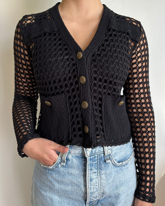 Female model wearing a black long sleeve cotton crochet cardigan with pockets and a tank top - Pete Collection