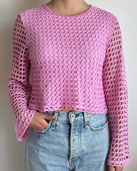 Female model wearing a peony pink crochet bell sleeve long sleeve cotton knit - Pete Collection