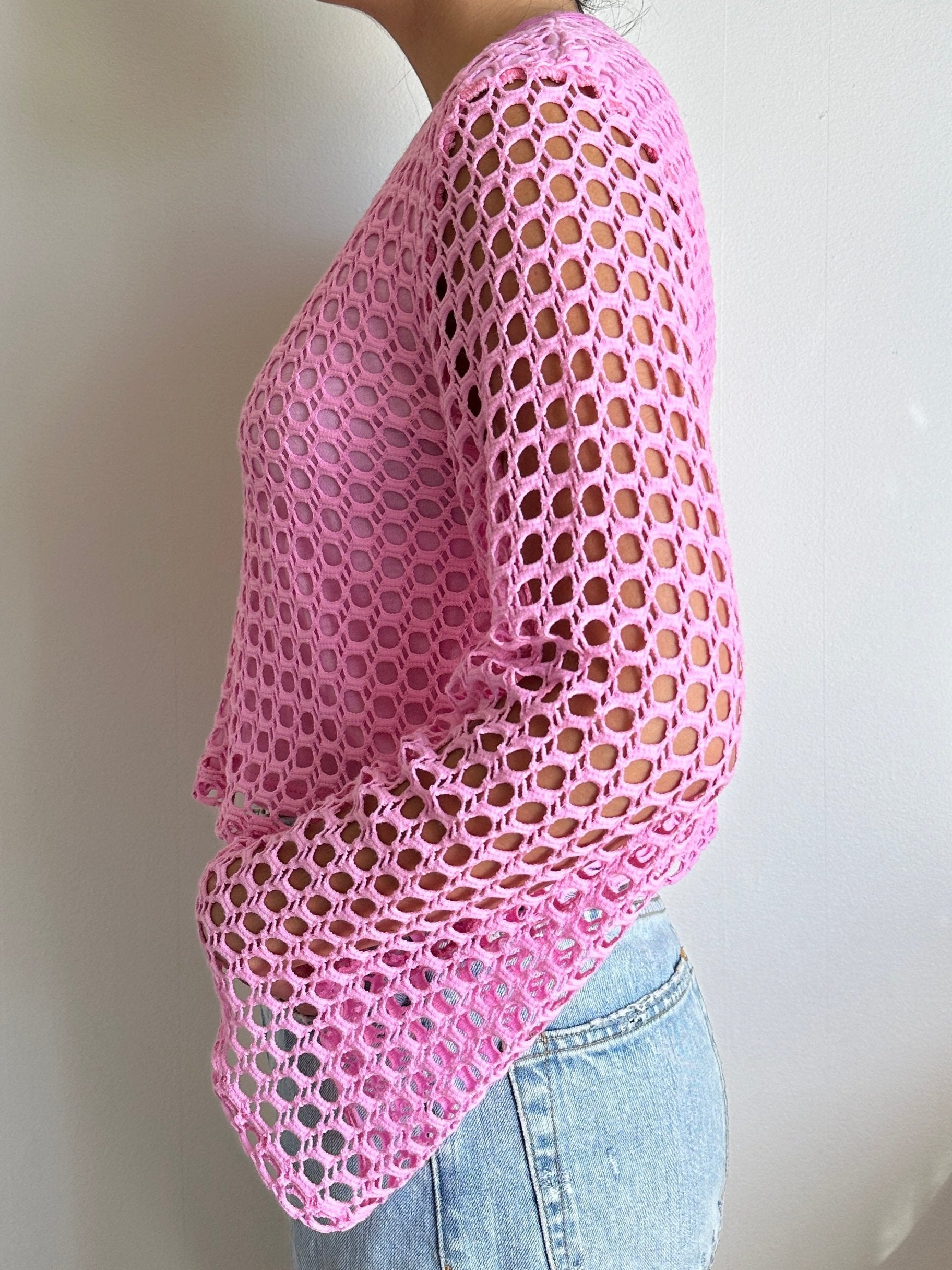 Female model wearing a pink crochet bell sleeve long sleeve cotton knit - Pete Collection