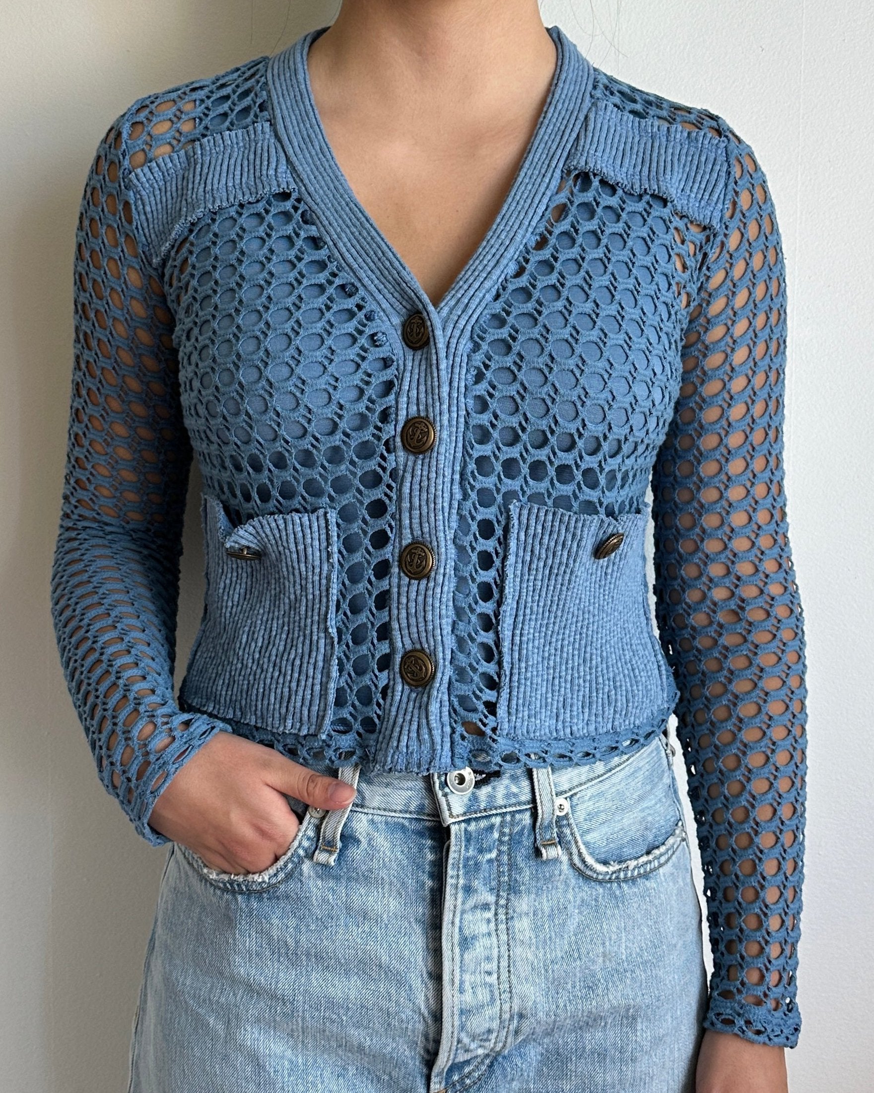 Female model wearing a vintage blue long sleeve cotton crochet cardigan with pockets and a tank top - Pete Collection