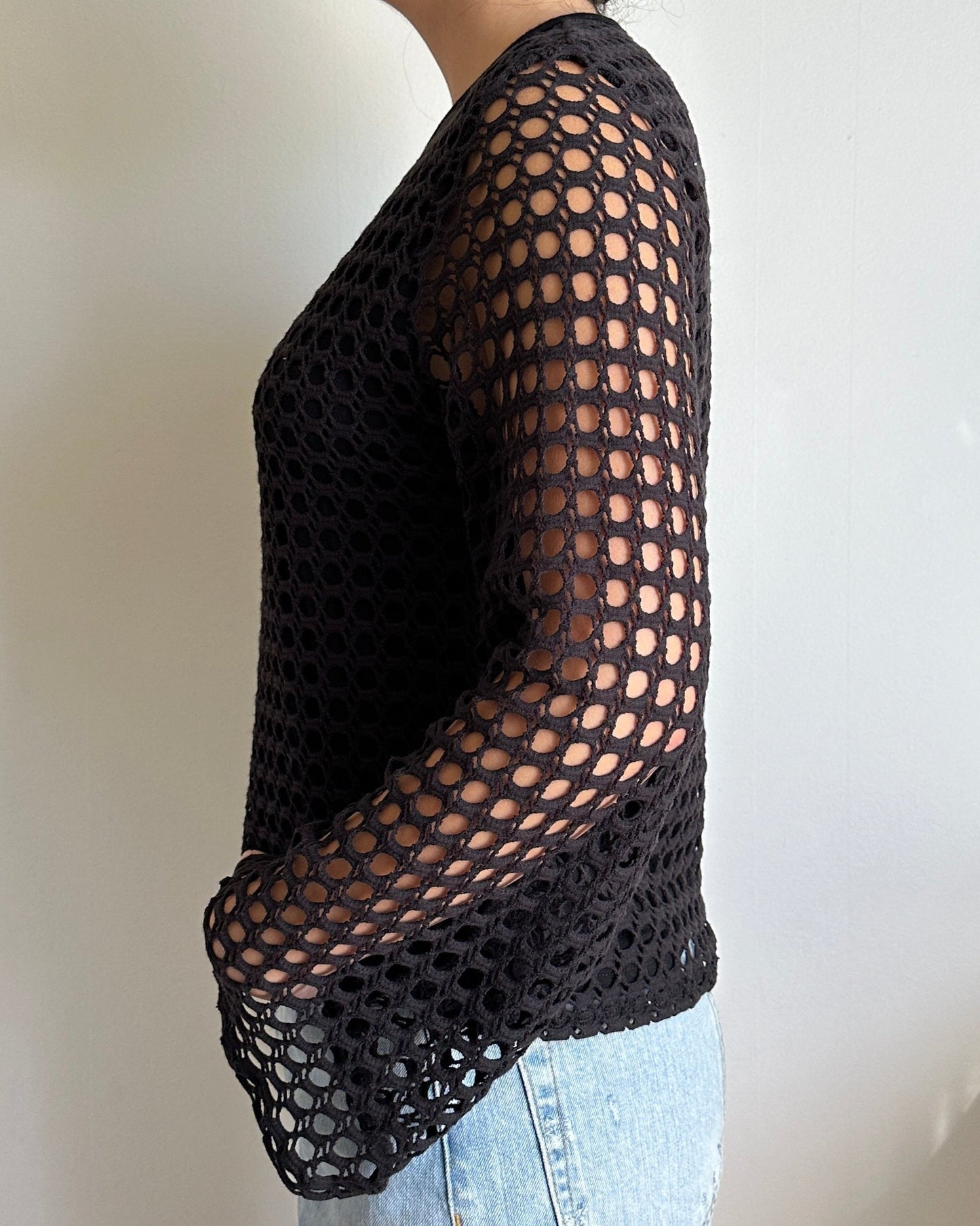 Female model wearing a black crochet bell sleeve long sleeve cotton knit - Pete Collection