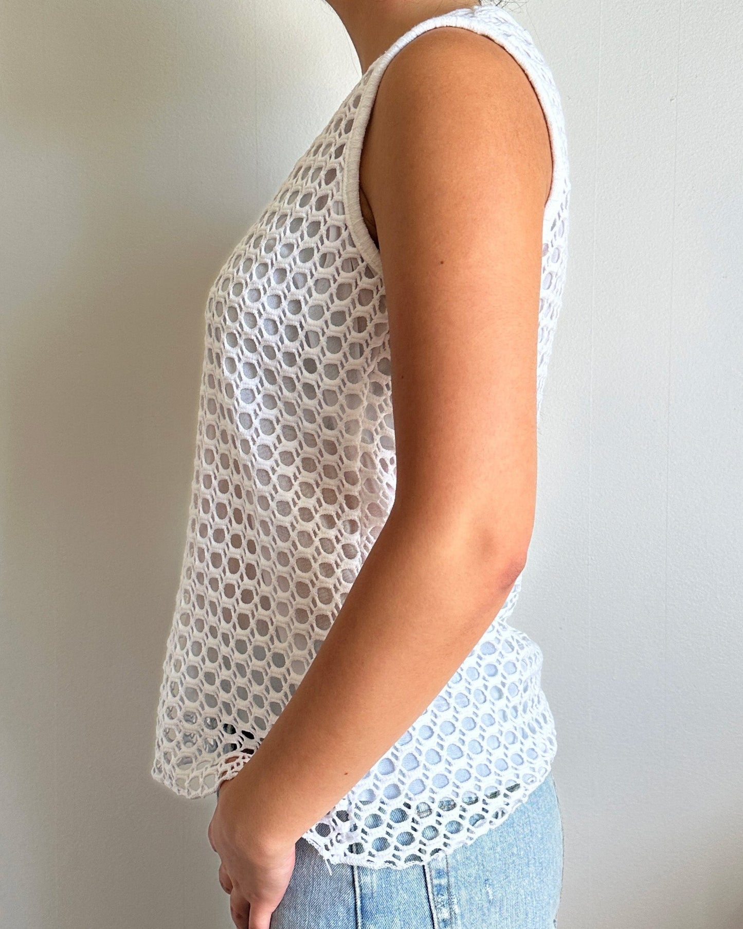 Female model wearing a v neck coconut milk (white) cotton crochet tank top - Pete Collection