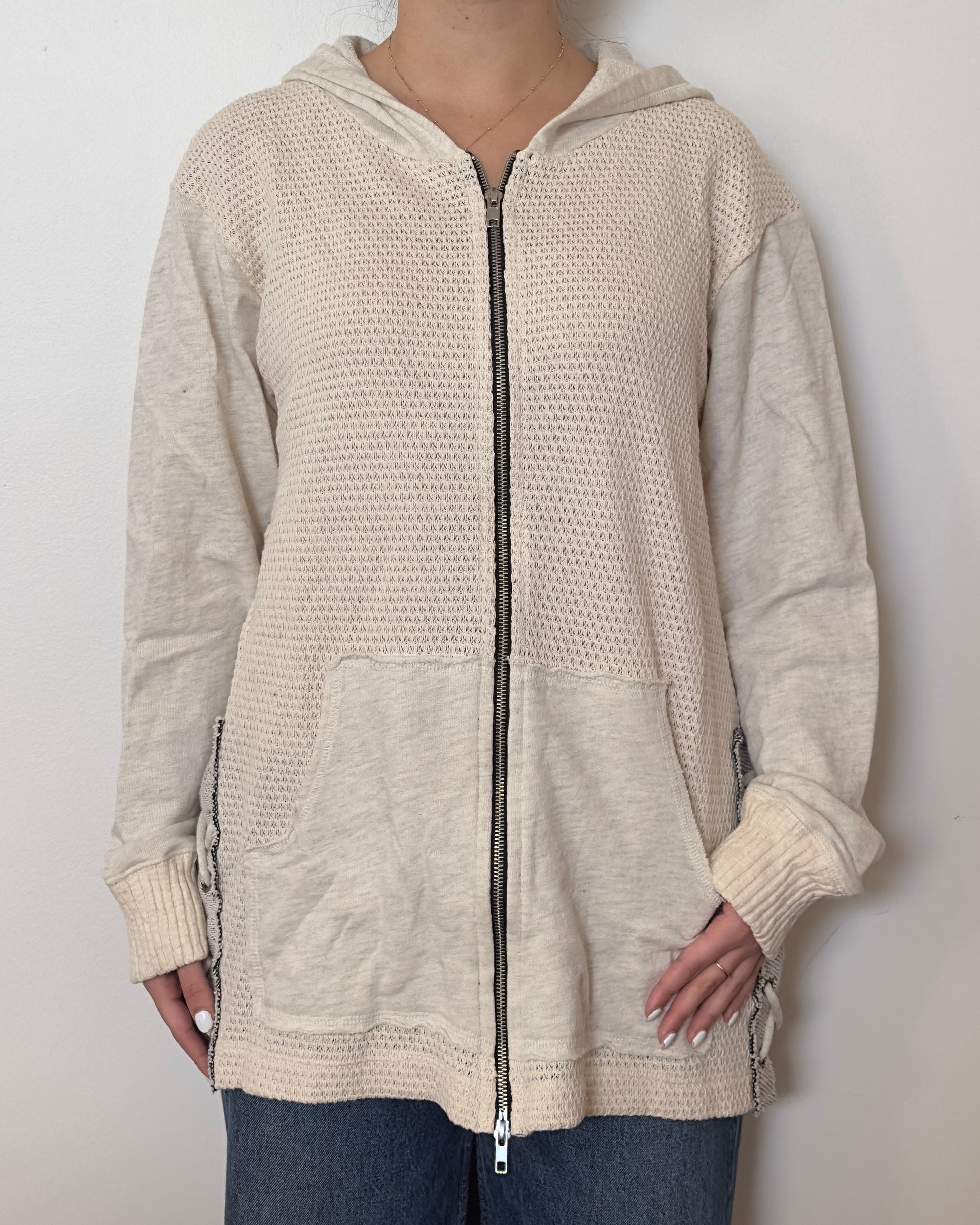 Female model wearing an oversized textured cotton jacket with patchwork sleeves and pockets and tied sides- Pete Collection