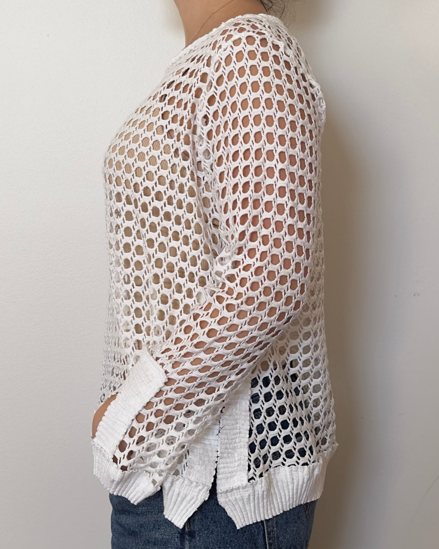 Female model wearing a solid crochet white long sleeve cotton knit - Pete Collection