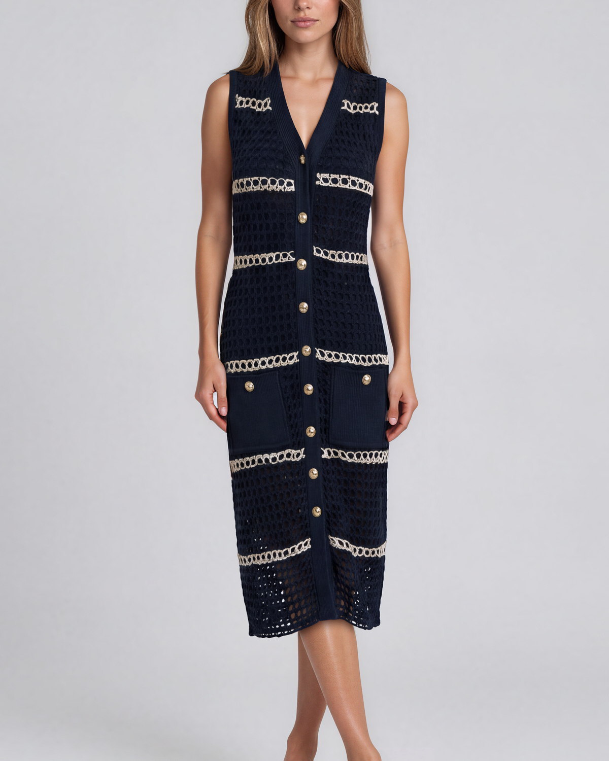 Sleeveless stripe crochet dress with a V-neckline and Button-front closure.
Open-stitch knit with contrast detailing in navy blue and cream, beige, linen colors.
Decorative front pockets with gold-tone button accents, midi length
Unlined open-knit panels create a lightweight, breathable feel
Made in Los Angeles
Pete Collection