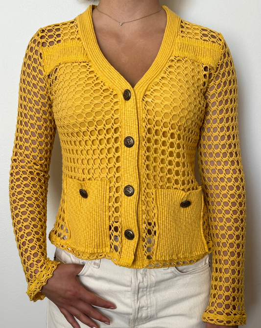 Female model wearing a tuscan sun (yellow) long sleeve cotton crochet cardigan with pockets and a tank top - Pete Collection