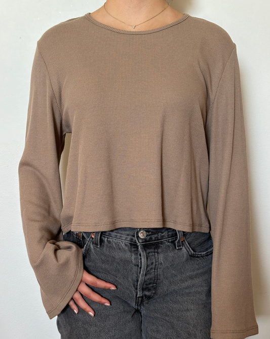 Female model wearing a bark (beige) bell sleeve long sleeve cotton knit - Pete Collection